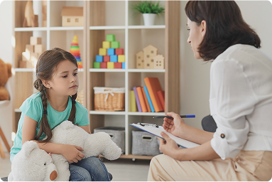 Counselor talking to a child about their feelings