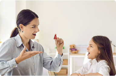 Speech therapist helping child with speaking